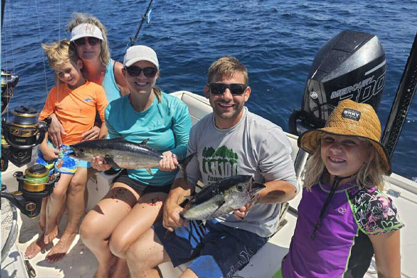Anglers displaying their catch on a fishing trip in Key Largo with Beyond Blessed Charters