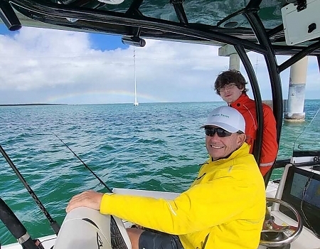 Two men on a boat with fishing rods ready for offshore fishing in Key Largo.
