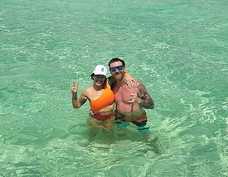 Couple standing in shallow water during a sandbar adventure in Islamorada.