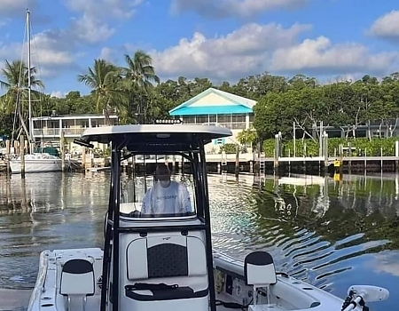 Boat at a dock with houses in the background during an Islamorada boat tour.